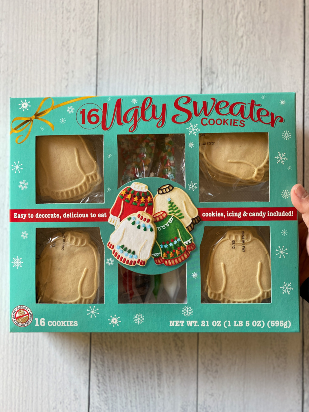 a commercial ugly sweater cookie kit