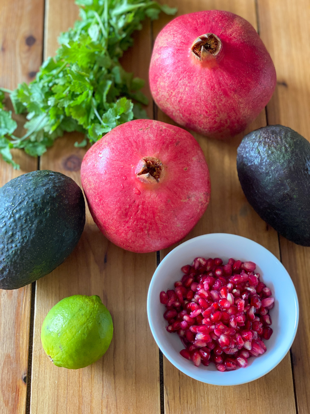 Avocados, pomegranate, lime, cilantro