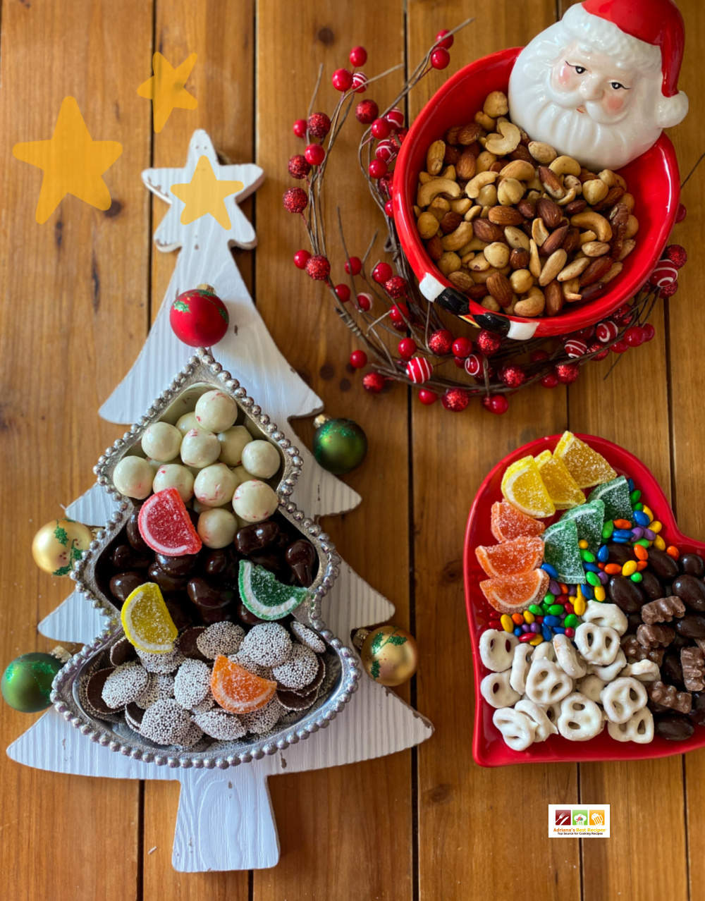 Christmas themed candy board with nuts, chocolate, and gummies