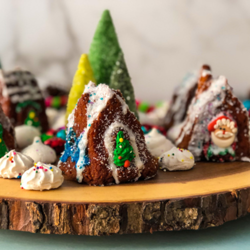 Edible Christmas Village with Apple Cupcakes setup on a wooden tray
