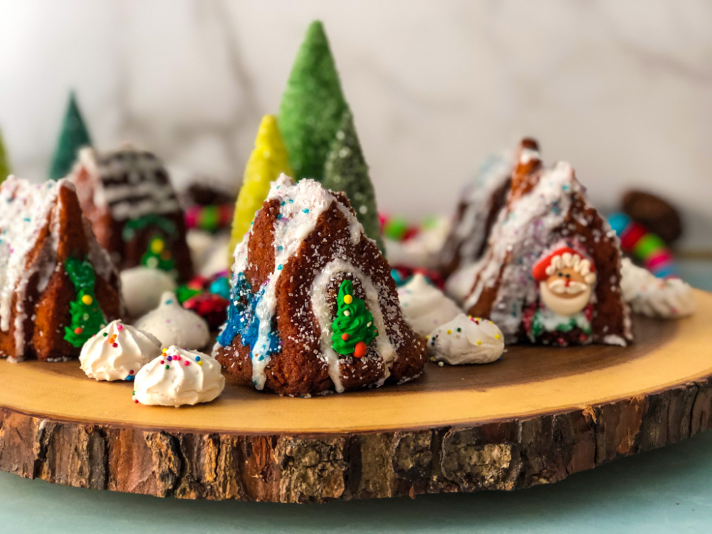 Edible Christmas Village with Apple Cupcakes setup on a wooden tray