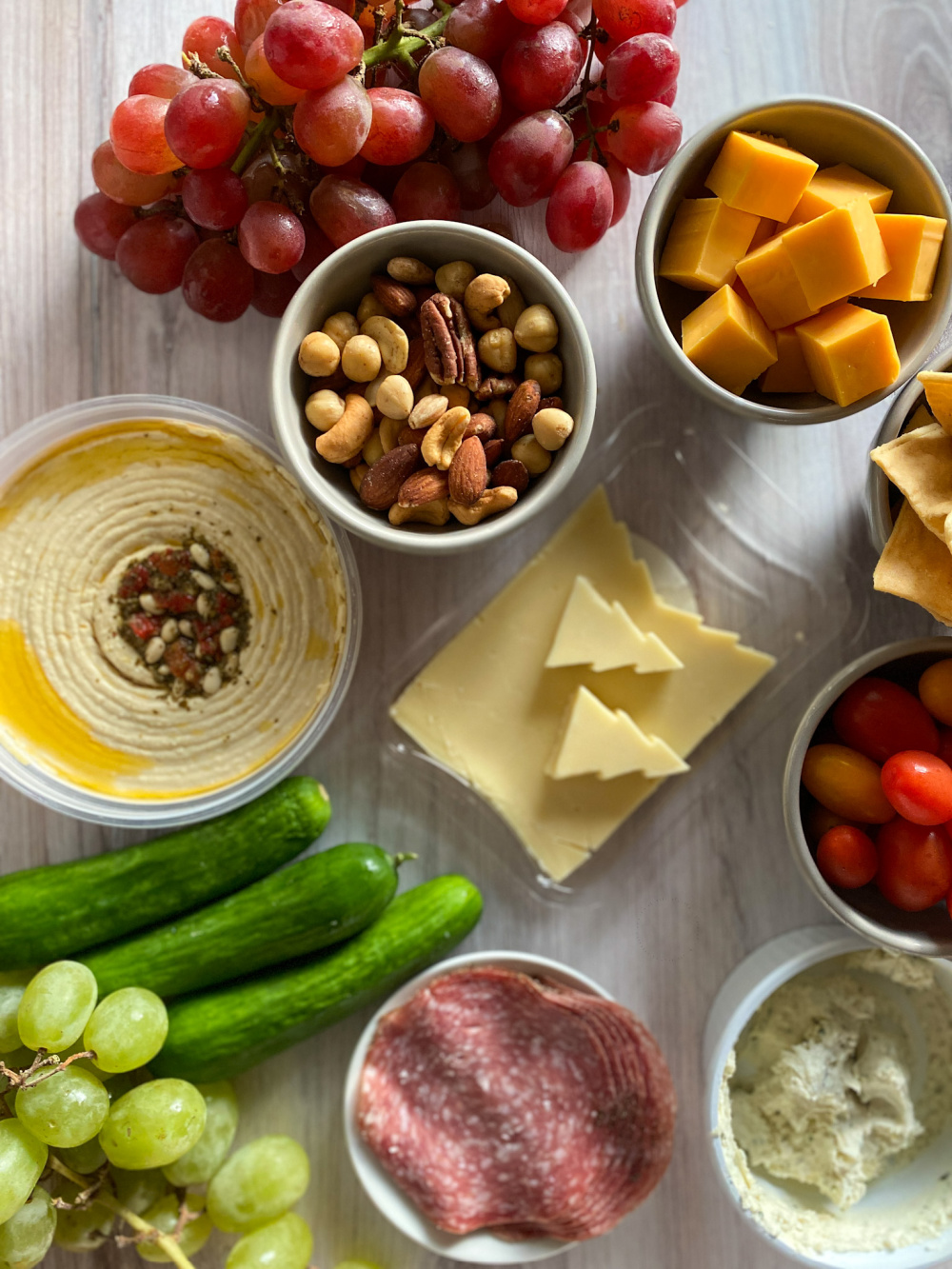 Ingredients for the holiday cheese board include fresh grapes