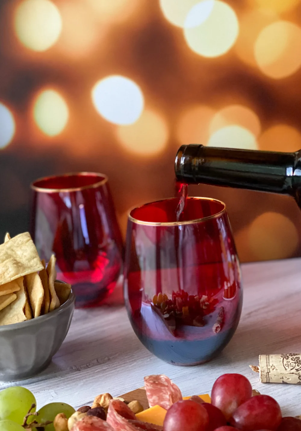 Pouring red wine to a glass