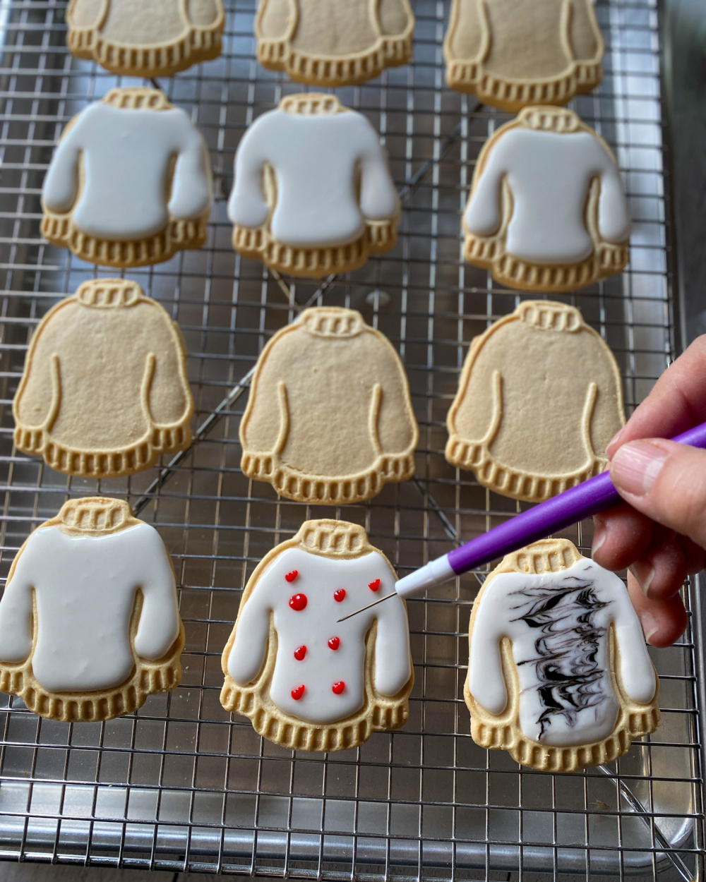 using a cookie scriber for leveling the icing and for making designs
