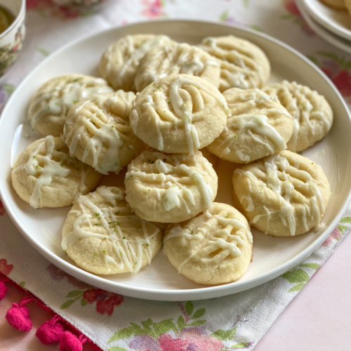 A plate with Brazilian butter cookies and a lime glaze