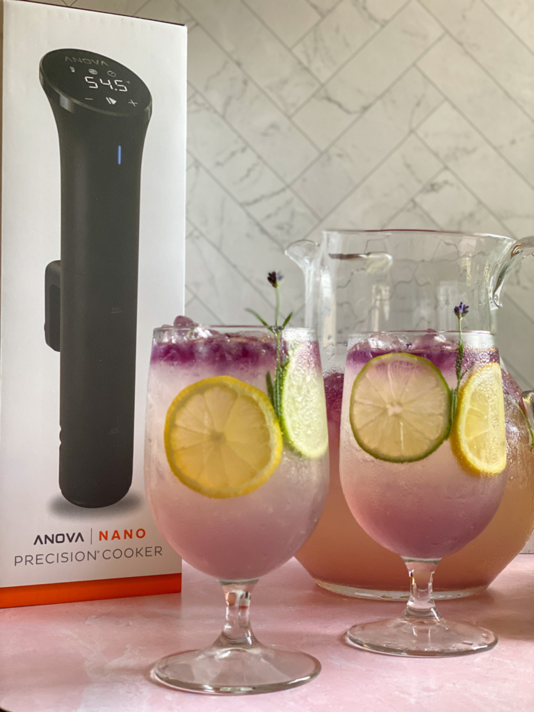 Two glasses with lavender lemonade and the Anova Precision Cooker Nano