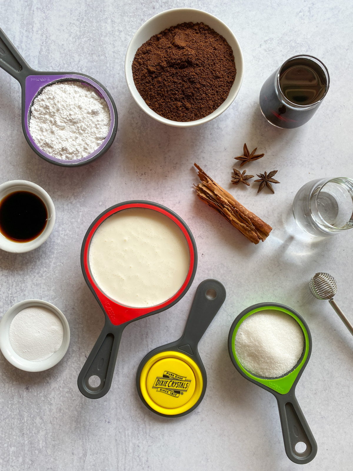 Ingredients for making a spiked java with tequila include cinnamon, star anise, sugar cane, liqueur, and homemade whipped cream.