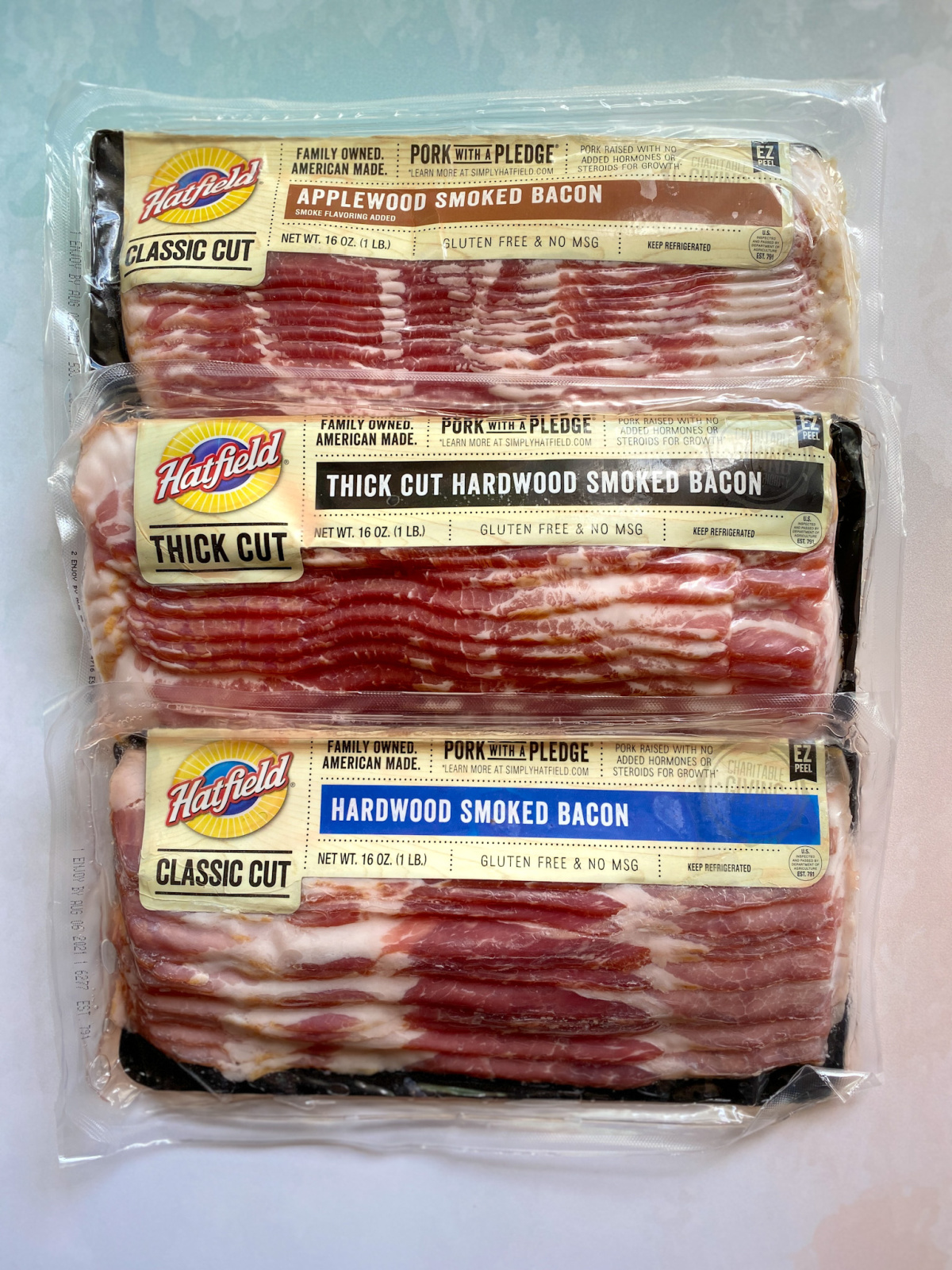 three packages of Hatfield bacon
