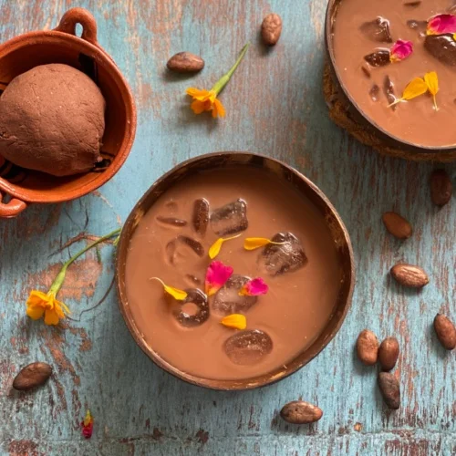 Two bowls of pozol made with cacao and corn masa