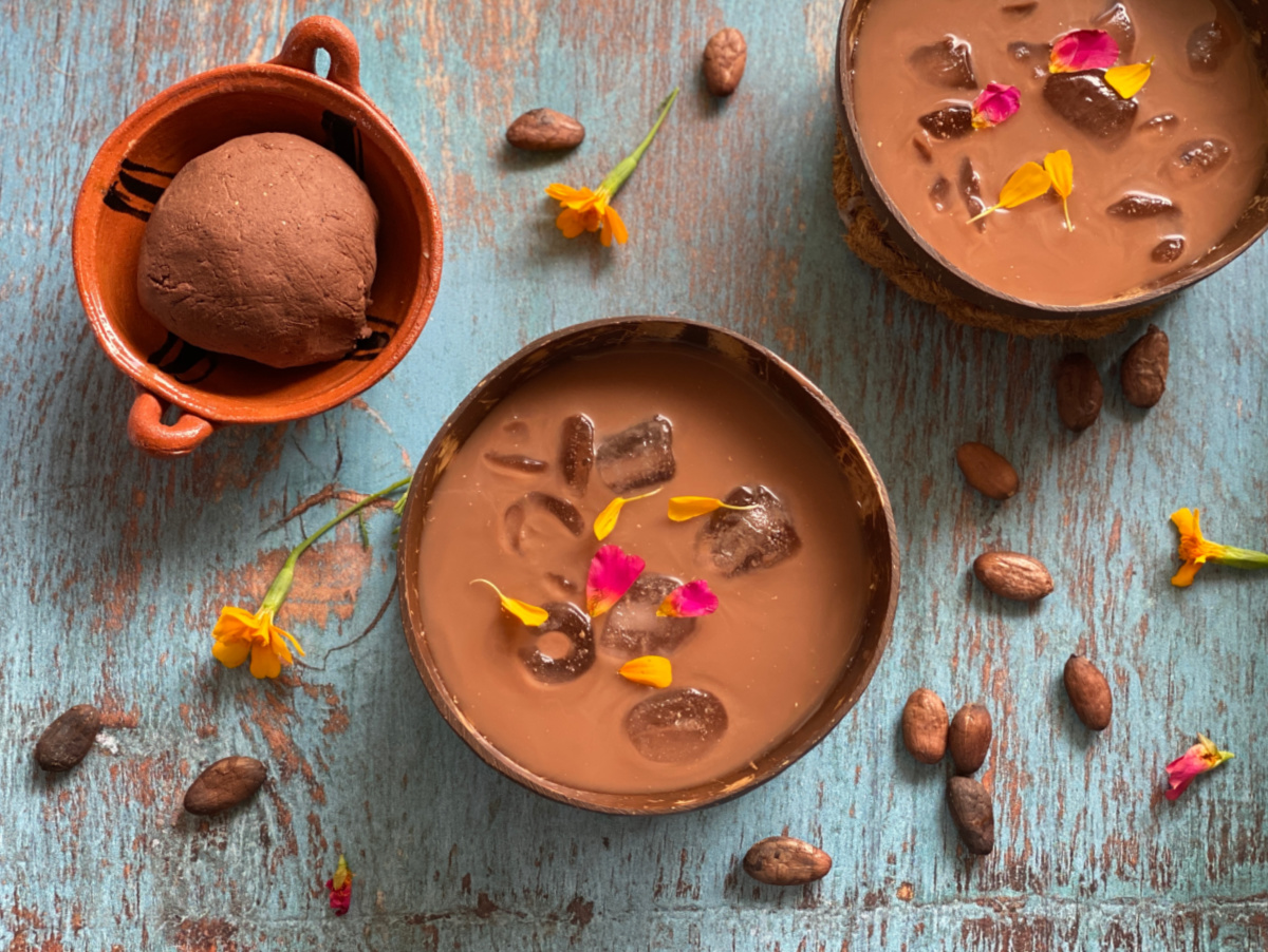 Two bowls of pozol made with cacao and corn masa