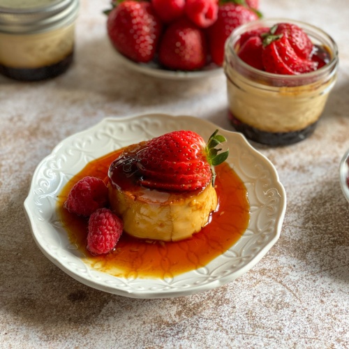 a plate with Mexican flan topped with berries