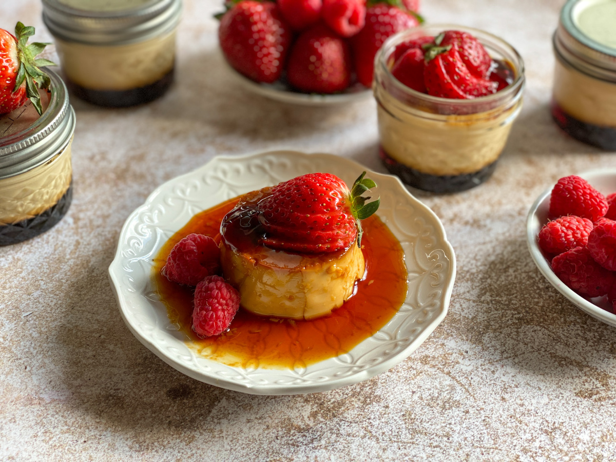 a plate with Mexican flan topped with berries