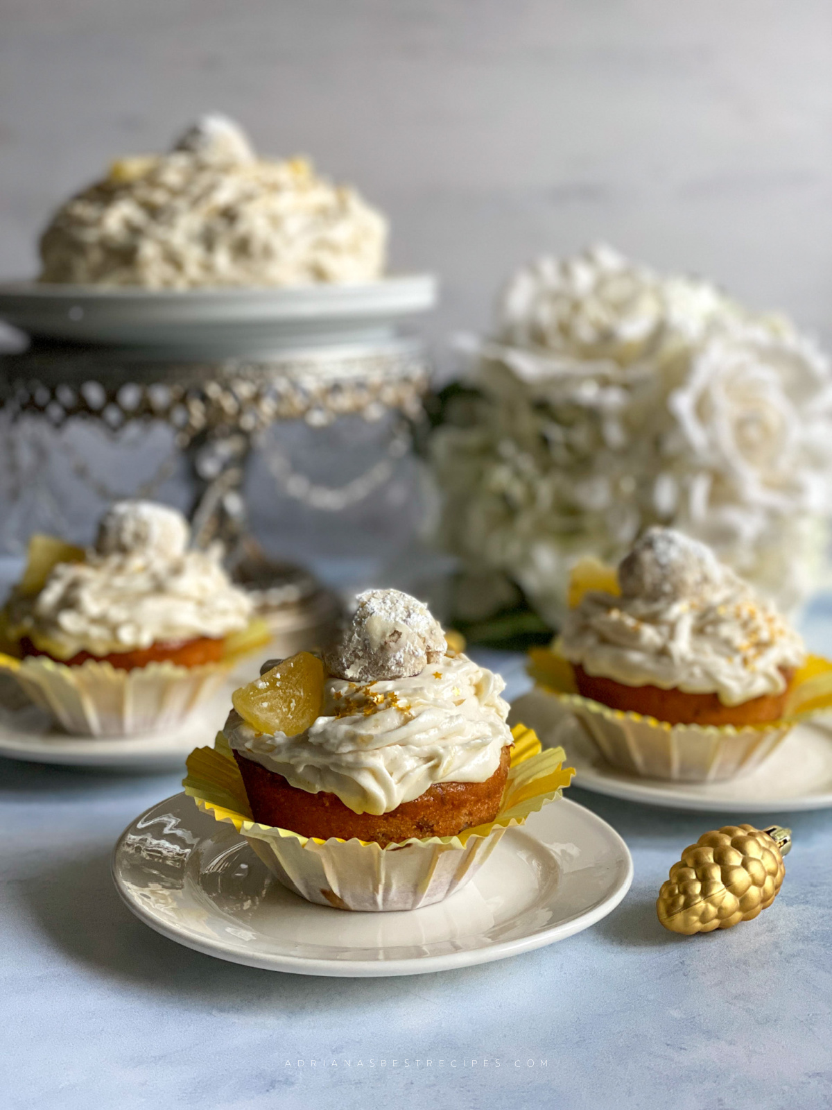 The pineapple pecan cupcakes we decorated with golden edible sparkles and Mexican wedding cookies as a topper