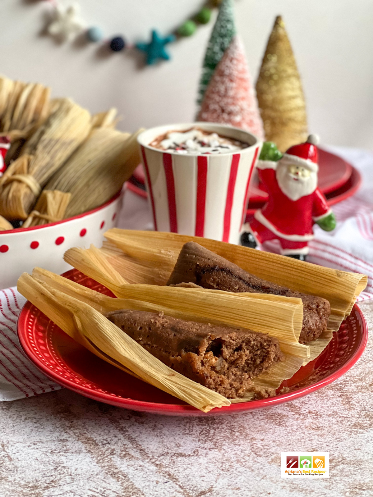 a plate with the best chocolate tamales paired with a cup of gourmet hot cocoa 