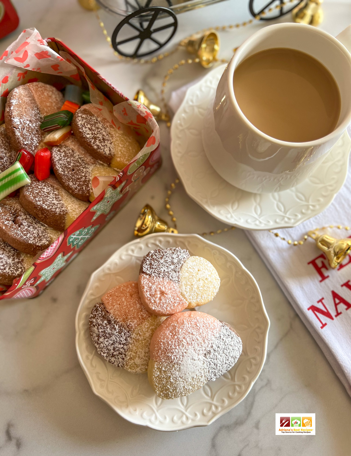 Enjoying Mexican shortbread cookies with a cup fo cafe con leche