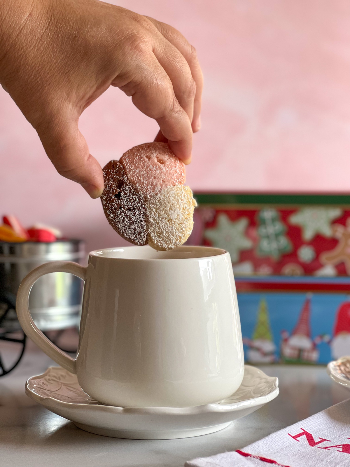 a hand holding a cookie