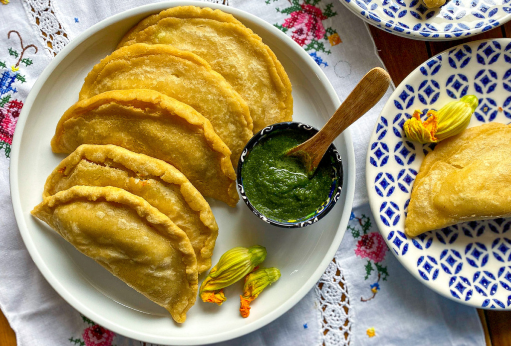 a plate with fried squash blossom quesadillas