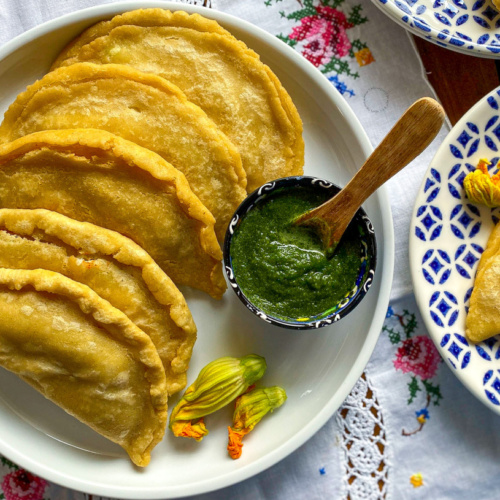 a plate with fried squash blossom quesadillas