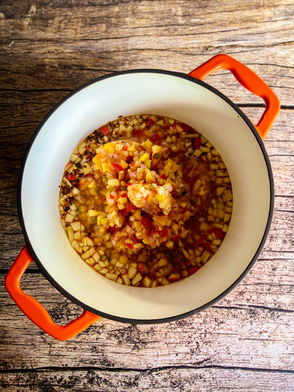 a pot with roughly chopped fruits